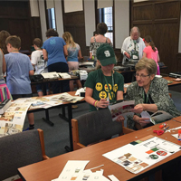 Grandparent and grandchild working on an interior design project