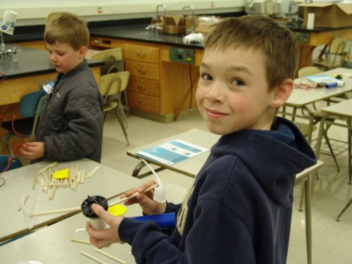 Youth working on wind turbine