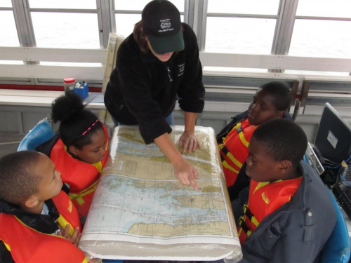 Students learning on a shipboard excursion in the Detroit area.