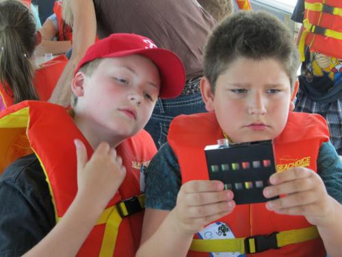 Students learning on a shipboard excursion in the Detroit area.