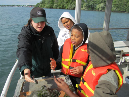 Students learning on a shipboard excursion in the Detroit area.