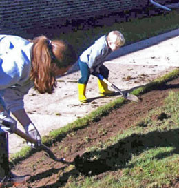 Keegan helping in the garden