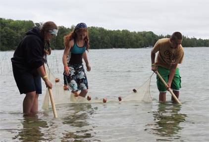 Great Lakes Natural Resource Camp participants gathering samples.