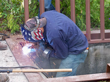Student welding bat gate image.