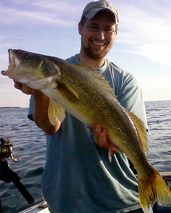 Fisherman with prize catch image.