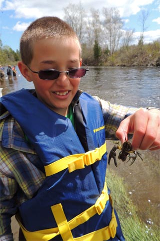 Boy with crayfish image.