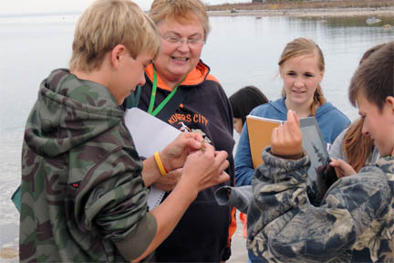 Rogers City Middle School THSP - teacher with students exploring samples image.