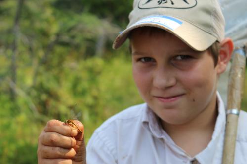 Male youth with Hines Emerald Dragonfly.