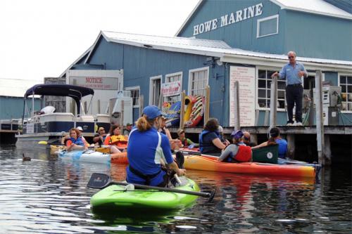 Teachers kayaking and learning about Clean Marinas in Michigan image.
