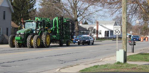 Farm equipment stopped after construction site close call.