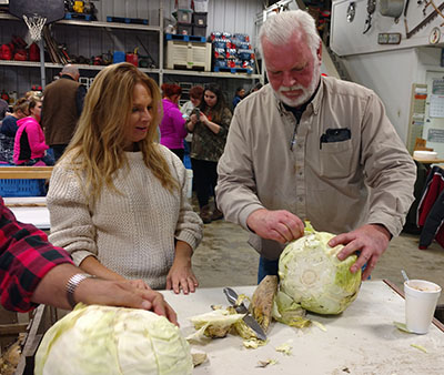 George VanHoutte removes wrapper leaves of cabbage