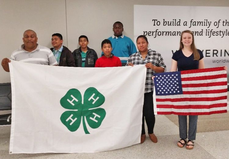 Youth with 4-H and America flags