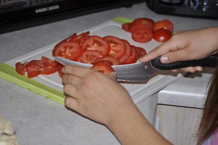 Children can help with the food prep process. Assign them a job suitable for their age and skill level.