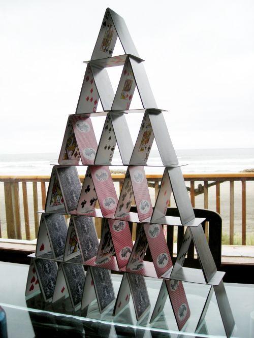 Try building a card castle shaped as a triangle. Photo by Wikimedia Commons