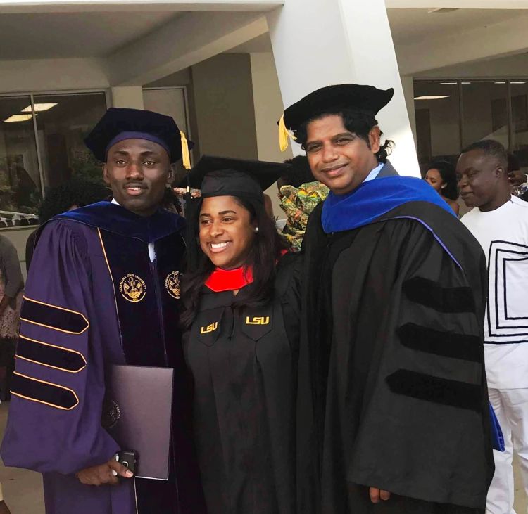 Emmanuel Kyereh (left) stands with fellow graduates from Louisiana State University.