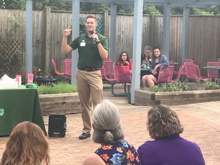 A Michigan 4-H State Youth Leadership Council member putting their ambassador skills to work speaking during 4-H Exploration Days. Photo Credit: Jackelyn Martin.
