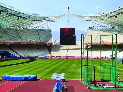 : The portable athletic field covering the  grounds of the Olympic Stadium in Athens, Greece. 
