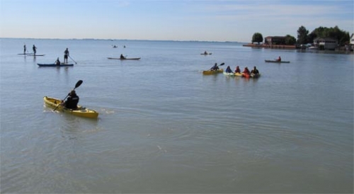 Group of kayakers on the Great Lakes.